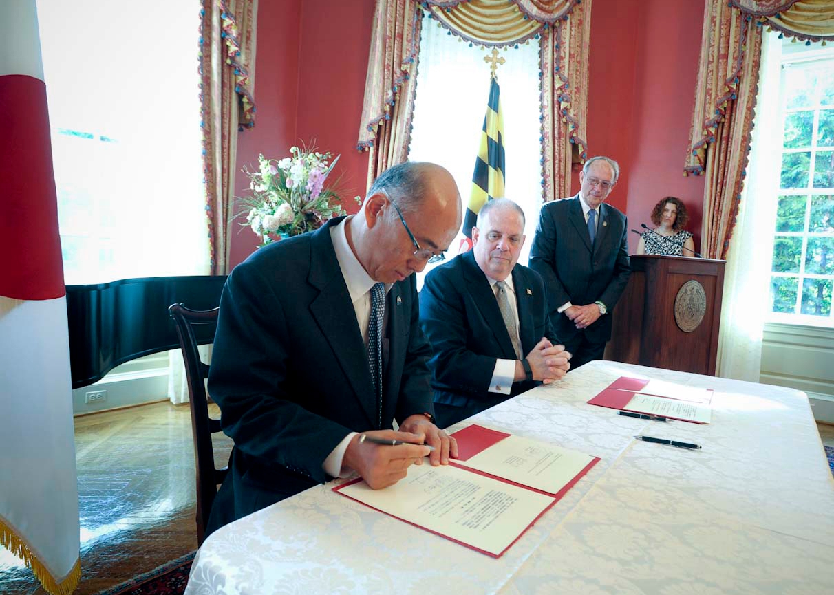 Ambassador Sasae signing